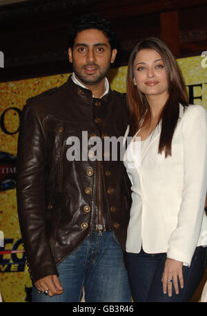 Abhishek Bachchan (left) and wife Aishwarya Rai Bachchan pictured during a photocall for the 'Unforgettable Tour' - the biggest ever Bollywood stage show - at the Crown Plaza St James Hotel in south west London. Stock Photo