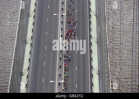 Riders cross the Humber Bridge during stage five of the Tour of Britain cycle race. Stock Photo