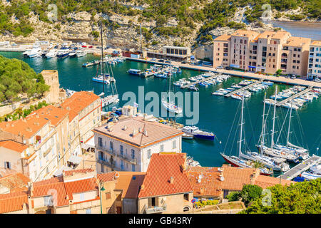 BONIFACIO PORT, CORSICA ISLAND - JUN 23, 2015: A view of Bonifacio port with colorful houses and boats, Corsica island, France. Stock Photo