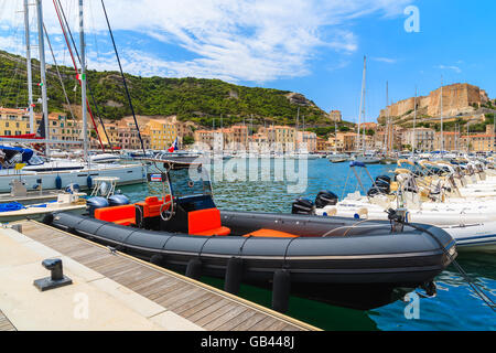 BONIFACIO PORT, CORSICA ISLAND - JUN 25, 2015: boats anchoring in Bonifacio port with citadel building in background. Bonifacio Stock Photo