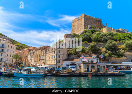 BONIFACIO PORT, CORSICA ISLAND - JUN 25, 2015: boats anchoring in Bonifacio port with citadel building in background. Bonifacio Stock Photo