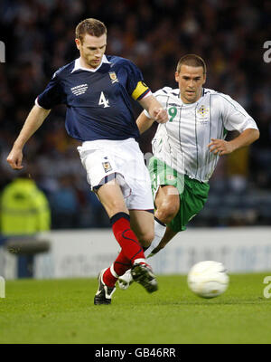 Scotland's Stephen McManus and Northern Ireland's David Healy during the Tennent's International Challenge Match at Hampden Park, Glasgow. Stock Photo