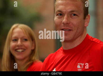 Great Britain's gold medal cyclist Chris Hoy and badminton player Gail Emms (left) watch a demonstration in a noodle bar at a Team B&Q media breakfast in Beijing, China. Stock Photo