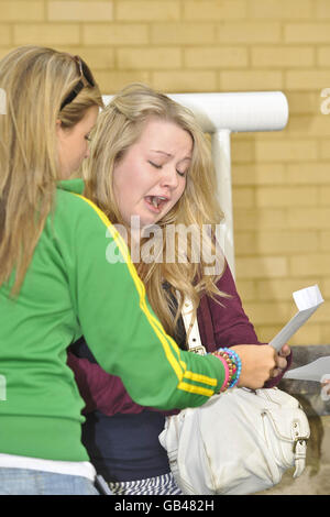 Rachel Slater (right), 16, from Cambridge celebrates getting 10 A* GCSE results at Badminton school in Bristol. Stock Photo