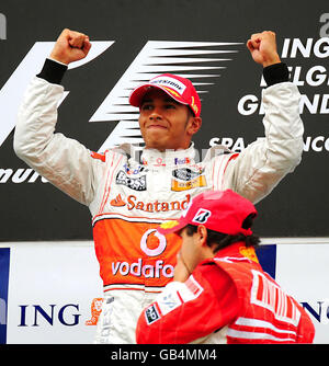 McLaren Mercedes' Lewis Hamilton of Great Britain celebrates on the podium after winning the Belgian Grand Prix at Spa Francorchamps, Belgium. Stock Photo