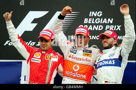 McLaren Mercedes' Lewis Hamilton celebrates on the podium after winning the Belgian Grand Prix, with Ferrari's Felipe Massa (left) in second and BMW's Nick Heidfeld (right) in third place at Spa Francorchamps, Belgium. Stock Photo