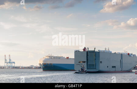 The Durban Highway, right,  passes the Eminent Ace, both automobile carriers or RORO ships (roll-on/roll-off) in Port Elizabeth in the New York and New Jersey harbor on Thursday, June 30, 2016.  (© Richard B. Levine) Stock Photo