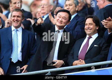 Soccer - Barclays Premier League - Manchester City v Chelsea - City of Manchester Stadium. Former Manchester City owner Thaksin Shinawatra (centre) in the stands Stock Photo