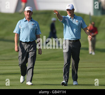 Europe's Justin Rose (right) talks with Miguel Angel Jimenez (left) during team practise at Valhalla Golf Club, Louisville, USA. Stock Photo