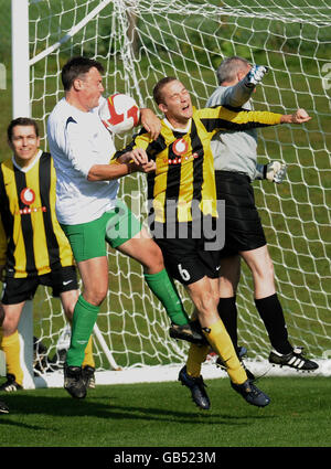 Schools Secretary Ed Balls (left) with PA reporter Jack Doyle, take part in a football match between MPs and the media at Manchester United's training ground, ahead of the second day of the 2008 Labour Party Conference in Manchester. Stock Photo