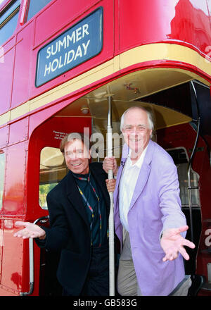 Sir Cliff Richard (left) and Sir Tim Rice on a Routemaster Bus before the unveiling of a commemorative plaque in honour of Sir Cliff Richard at Elstree Studios. Stock Photo