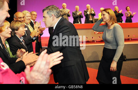 Prime Minister Gordon Brown and wife Sarah stand on stage following his speech to the Labour Party conference at Manchester Central, in Manchester. Stock Photo