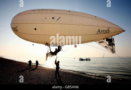 Stephane Rousson pedals his inflated blimp away from Hythe beach in Kent, in an attempt to be the first person to cross the English Channel with a muscular powered airship. Stock Photo