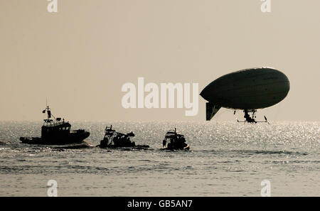 Stephane Rousson pedals his inflated blimp away from Hythe beach in Kent, in an attempt to be the first person to cross the English Channel with a muscular powered airship. Stock Photo