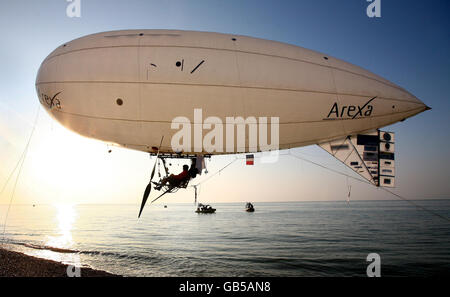 Stephane Rousson pedals his inflated blimp away from Hythe beach in Kent, in an attempt to be the first person to cross the English Channel with a muscular powered airship. Stock Photo