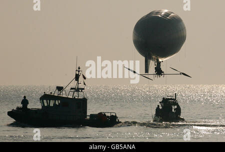 Stephane Rousson pedals his inflated blimp away from Hythe beach in Kent, in an attempt to be the first person to cross the English Channel with a muscular powered airship. Stock Photo