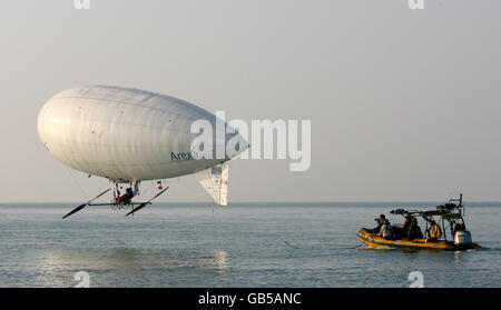 Stephane Rousson pedals his inflated blimp away from Hythe beach in Kent, in an attempt to be the first person to cross the English Channel with a muscular powered airship. Stock Photo