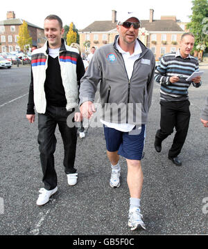 Sir Ian Botham (centre) walks through the centre of Bury St Edmunds, Suffolk, on the fourth day of his charity walk in aid of Leukaemia Research. Stock Photo