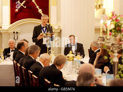 Lord Mayor of the City of London, Alderman David Lewis addresses the annual City Banquet at Mansion House in London, as the chairman of the Financial Services Authority Sir Callum McCarthy (left) looks on. Stock Photo