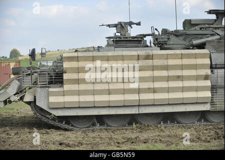 Body armour fitted to a Challenger Armoured Repair and Recovery vehicle in the form of heavy duty metal grids causing anti-tank weapons to detonate further from the body of the vehicle and prevent full penetration through the vehicle's skin. The Army Urgent Operational Requirement (UOR) day, held at Salisbury Plain showcases new modifications to existing vehicles and equipment that is being sent out to warzones plus new mllitary equipment that is undergoing trials for possible issue to troops on operations. Stock Photo