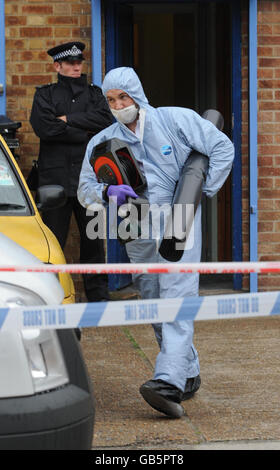 A police forensics officer attends the scene in Balaam Street, Plaistow, east London, following a stabbing outside a college. Stock Photo