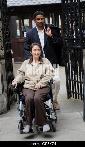 Multiple sclerosis sufferer Debbie Purdy, from Bradford, with husband Omar Puente at the High Court in London, where she is asking to clarify the law on assisted suicide. Stock Photo