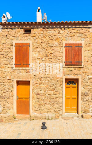 A stone facade of typical French house in Piana village, Corsica island, France Stock Photo