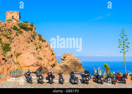 PORTO, CORSICA ISLAND - JUN 27, 2015: row of motorcycles parked in Porto. It is a small village to the west of Corsica, ideally Stock Photo