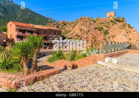 PORTO, CORSICA ISLAND - JUN 28, 2015: street with typical houses in Porto village which is located in western part of Corsica is Stock Photo