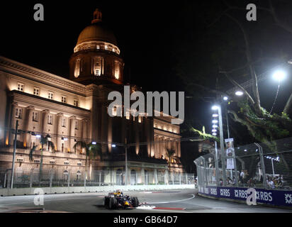 Red Bull driver David Coulthard drives past the Old Singapore Court House during a practice session at the Marina Bay Circuit Park in Singapore. Stock Photo