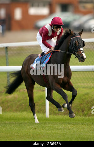 Horse Racing - Trinidad & Tobago Day - Pontefract. By Command ridden by Jimmy Quinn during the Trinidad & Tobago Handicap Stock Photo