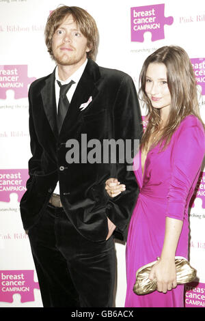 Kris Marshall (left) and Kelly Eastwood arrive at the Pink Ribbon Ball held at the Dorchester Hotel, Park Lane, London. Stock Photo