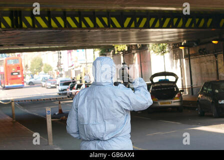 A police forensic officer at the scene on Stroud Green Road, Finsbury Park, north London where two men were injured in a clash between two groups early today, police said. Stock Photo