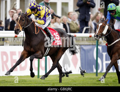 Horse Racing - Newmarket Racecourse - Cambridgeshire Meeting - Day Two. Serious Attitude ridden by Jimmy Fortune goes on to win the 32red.com Cheveley Park Stakes at Newmarket Racecourse, Suffolk. Stock Photo