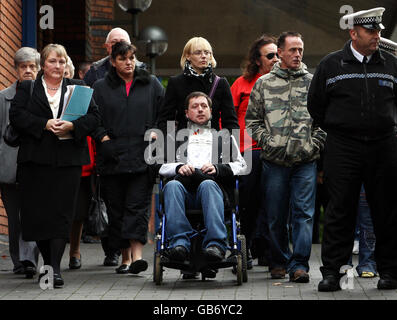 Phil and Amanda Peak (centre), with other family members outside Stoke on Trent Crown Court after footballer Luke McCormick was jailed for seven years for killing two their sons Arron and Ben. Stock Photo