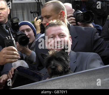 John Burns with Millie the dog leaves the Chesterfield Hotel in London after marrying the EastEnders actresses Wendy Richard. Stock Photo