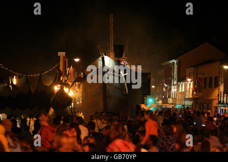 The grand finale of the Spraoi Festival, as a giant replica steam ship 'the Iron Tide' sails up the quays of Waterford City, Ireland, which use to be home to some of the biggest steam ships in the world. Stock Photo