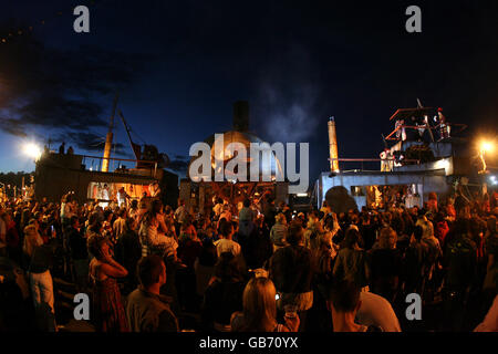 The grand finale of the Spraoi Festival, as a giant replica steam ship 'the Iron Tide' sails up the quays of Waterford City, Ireland, which use to be home to some of the biggest steam ships in the world. Stock Photo