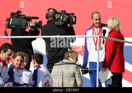 Olympics - Team GB Beijing Homecoming Parade - London. Gold and Silver medalsit Dr Tim Brabants is interviewd by BBC's Sue barker during the Team GB homecoming Parade in Central London Stock Photo