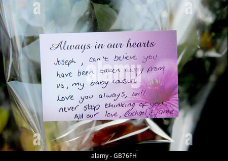 A message left at the scene where Joseph Lappin, 16, was stabbed to death after a gang attack outside a youth club in Liverpool last night. Stock Photo