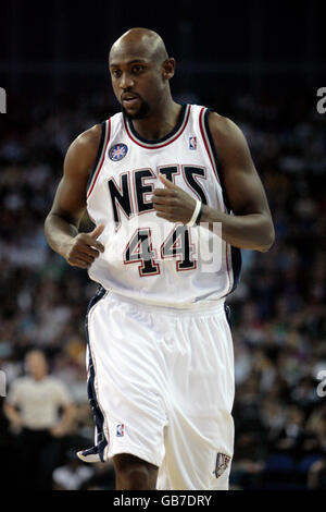 New Jersey Nets' Trenton Hassell (44) goes up for a shot against Golden ...