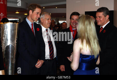 (clockwise from left to right) Prince William, accompanied by Welsh Rugby Union officers, Dennis Gethin, Roger Lewis and David Pickering, talks to royal harpist Claire Jones before watching Wales take on South Africa at rugby today. Stock Photo