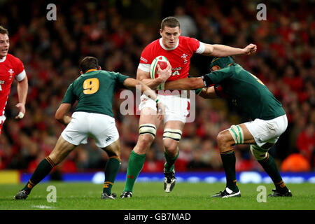 Ian Evans of Wales is tackled by Victor Matfield and Fourie Du Preez of South Africa during the Invesco Perpetual Autumn Series match at the Millennium Stadium, Cardiff. Stock Photo