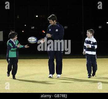 Scotland Rugby's Hugo Southwell passes with Craig Sheperd and Peter Thompson during the community day at the St Machar Academy Stock Photo