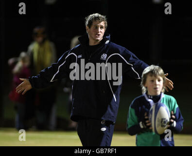 Scotland Rugby's Mark Robertson coaches the children during the community day at the St Machar Academy Stock Photo