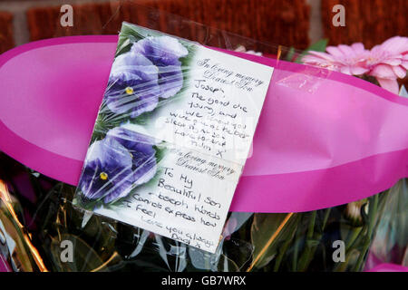 Tributes left by John and Toni Lappin with flowers at the scene where their son Joseph Lappin, 16, was stabbed to death outside a youth club in Everton on Monday night. Stock Photo