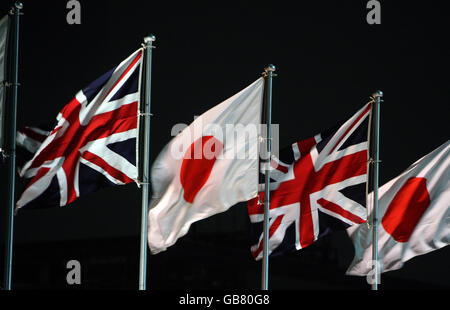 The national flags of Great Britain and Japan are flown as The Prince of Wales and the Duchess of Cornwall arrive at Haneda Airport in Tokyo, for the start of their official 10-day tour of the Far East. Stock Photo