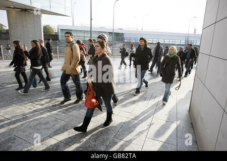 Shoppers wait in line to enter the Westfield Shopping Centre in White City, west London, on its opening day. Stock Photo