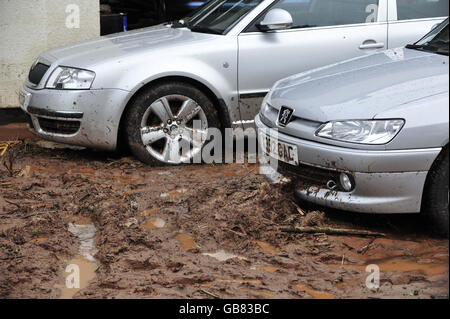 Cars on the forecourt of Ottery Motor Services garage at Coombe Lake Fairmile, Devon, after a freak hail storm. Stock Photo