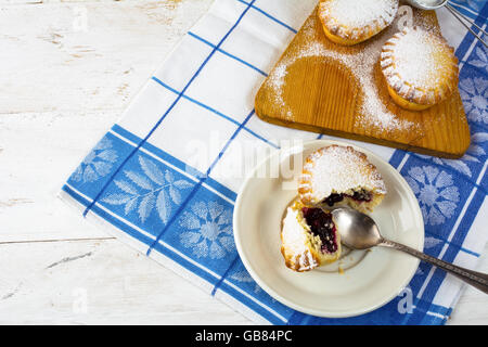 Confiture dessert pie on the white plate. Sweet dessert. Sweet pastry. Small pie. Pie. Jam pie Stock Photo